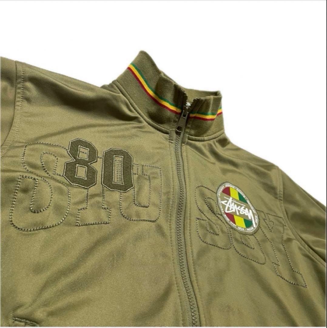 ステューシー トラックジャケット ラスタカラー 刺繍ロゴ ジャージ カーキ系 M