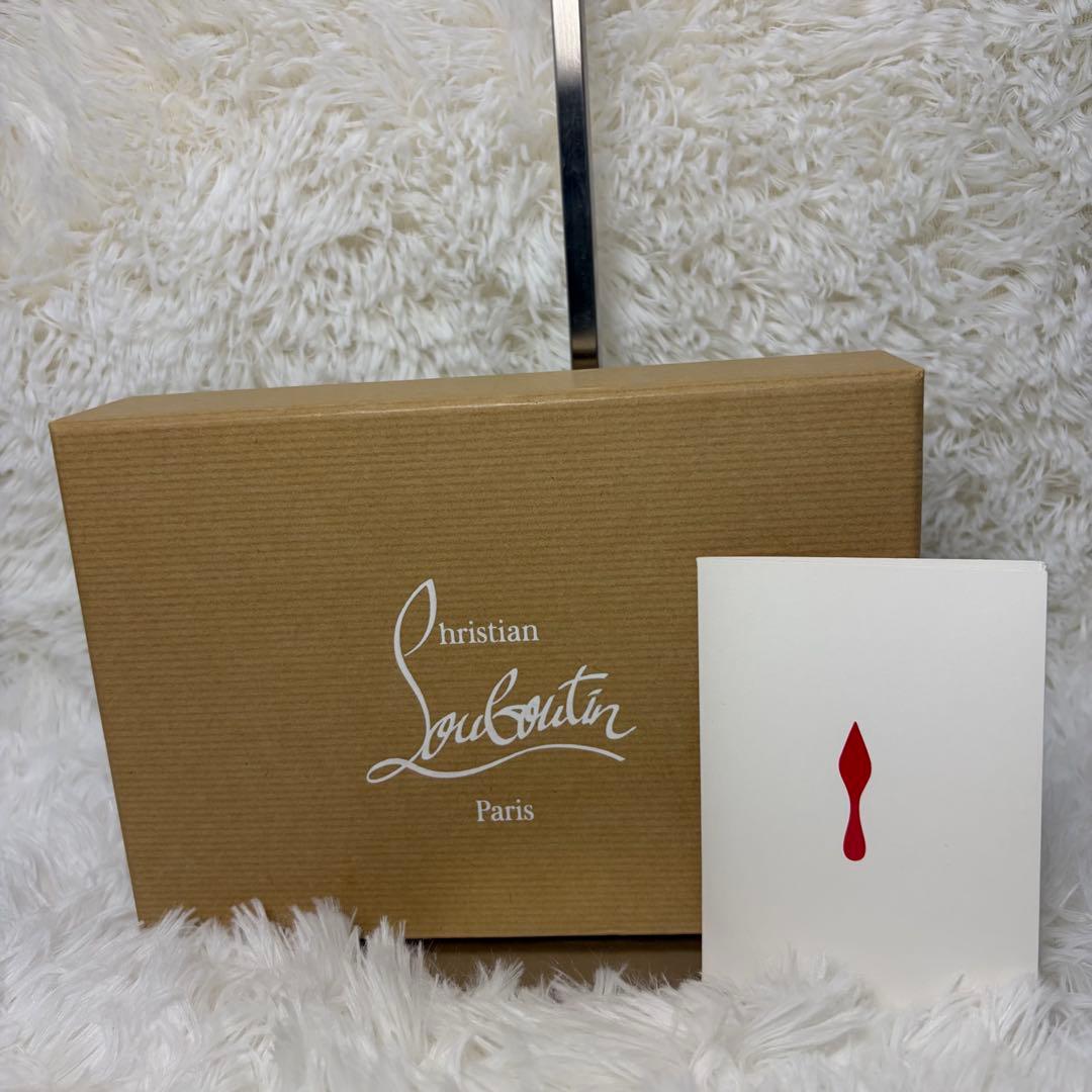 クリスチャンルブタンパネトーネ グラデーションスタッズ ラウンドジップ長財布