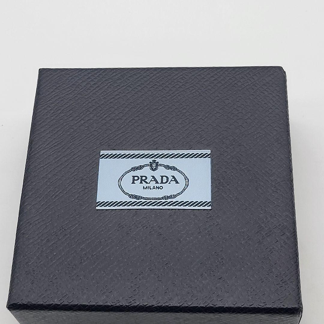 PRADA シルバー 三角形ピアス(片耳用) クリスタルロゴ ジュエル