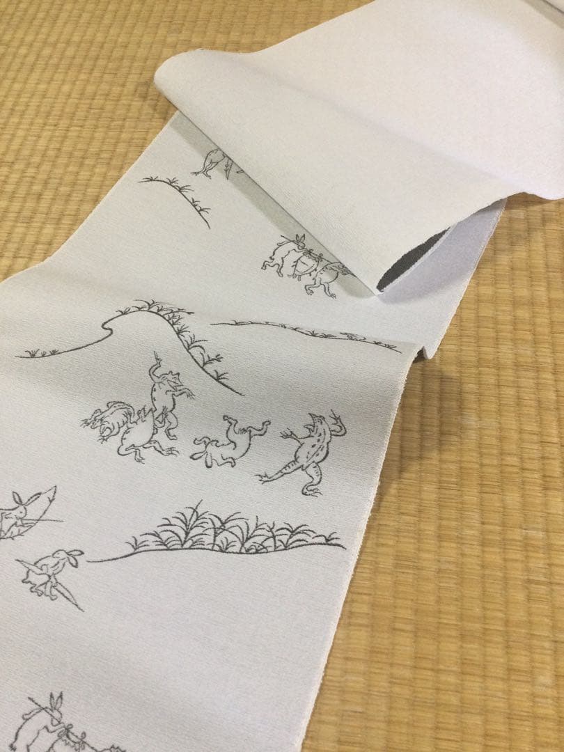 素敵な装い！西陣名古屋帯 綿芯仕立、ガード加工済「鳥獣人物戯画」薄グレー簡易包装